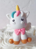 Small unicorn and rainbow cake topper